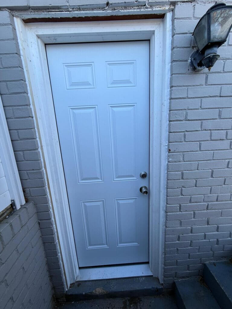 Carpentry repair team restoring wooden doors